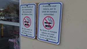 No smoking, in two languages, has been the policy at the Department of Human Services for a long time.