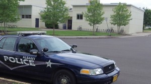 A patrol car parked outside West Albany High.