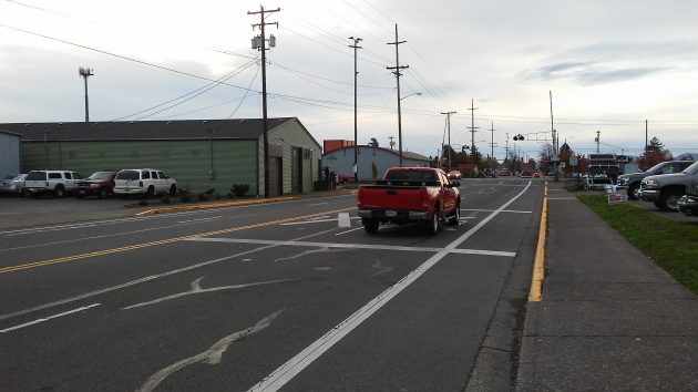 The red pickup is using the lane of Queen Avenue that would disappear under an ODOT plan to revamp the Queen Avenue crossing, in the background.